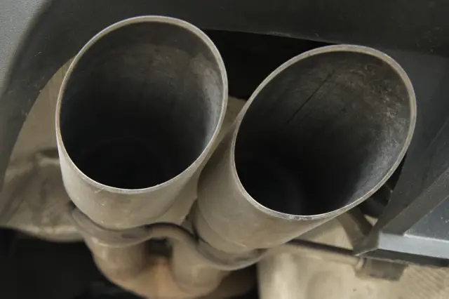 The dual exhaust pipes on a Volkswagen turbodiesel passenger car