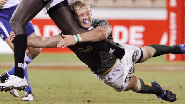 South African player Kyle Brown tackles