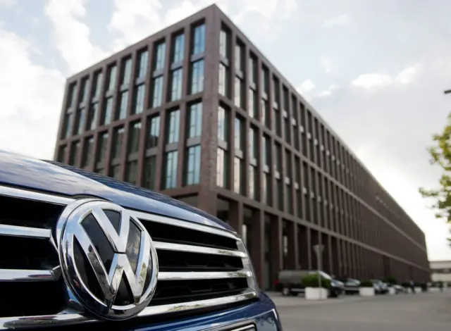 A Volkswagen vehicle is parked outside an administration building on the grounds of the VW plant in Wolfsburg, Germany, 23 September 2015