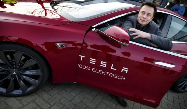 Elon Musk in a Tesla