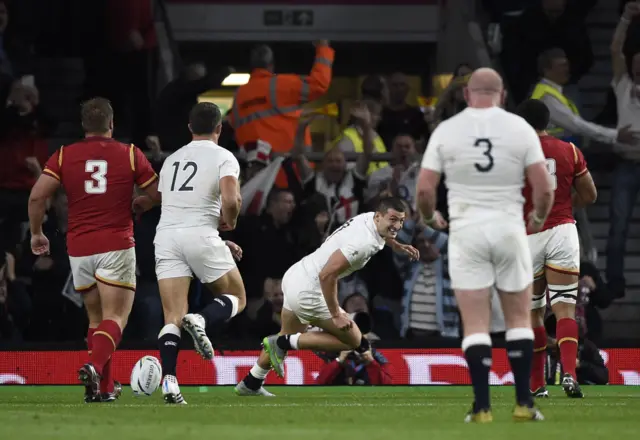 Jonny May smiles after scoring a try