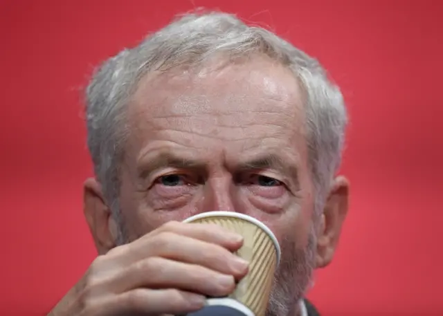 Jeremy Corbyn drinking from a cup