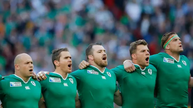 The Ireland players sing the national anthem