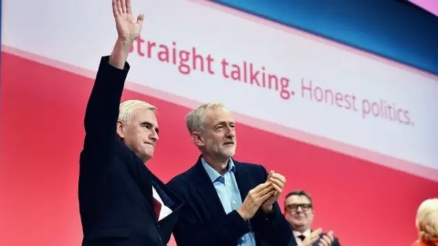 John McDonnell and Jeremy Corbyn on stage at Labour conference