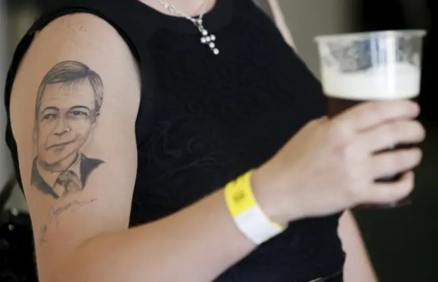 Woman sporting tattoo of UKIP leader Nigel Farage