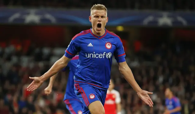 Alfred Finnbogason celebrates after scoring the third goal for Olympiakos