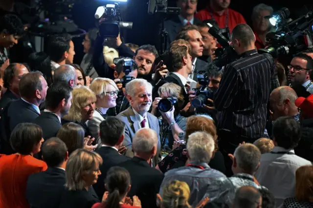 Jeremy Corbyn leaves the hall