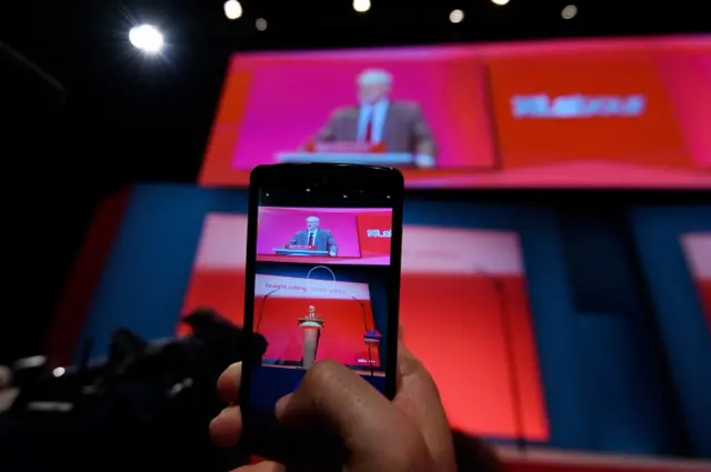 A conference member records the Labour leader's speech