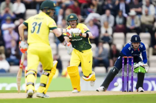 Australia's Steve Smith chases a run