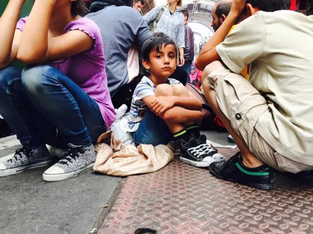 Young boy waiting on platform