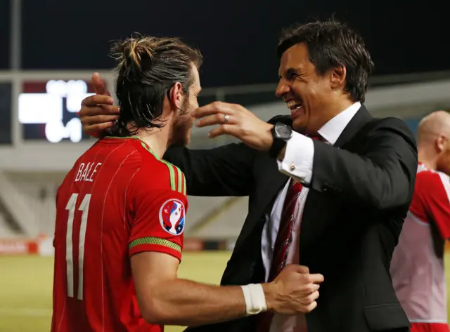 Gareth Bale celebrates with manager Chris Coleman