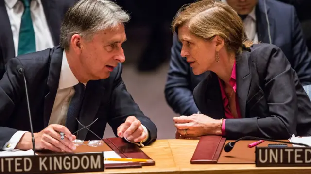 Philip Hammond, left, talks to US Ambassador to UN Samantha Power