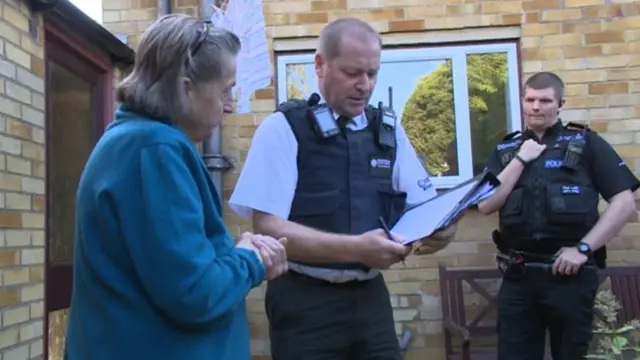 Woman with police officers