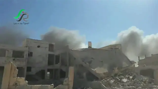 Screengrab from video posted online by opposition activist purportedly showing aftermath of Russian air strikes in Talbiseh, Homs province. 30 Sept 2015