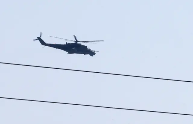 Russian-made helicopter hovers over Latakia airport in the government-controlled coastal Syrian city on September 24, 2015