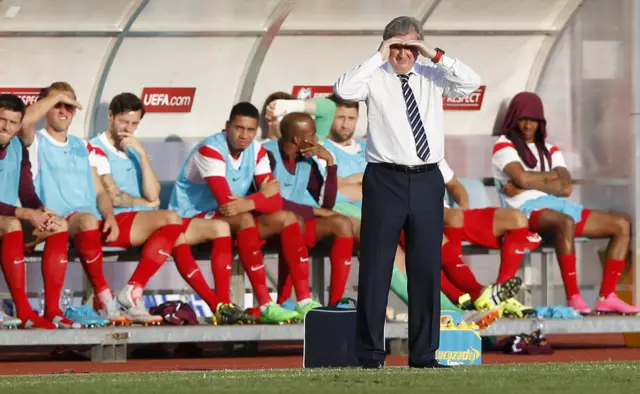 Roy Hodgson struggles to see in the sunlight