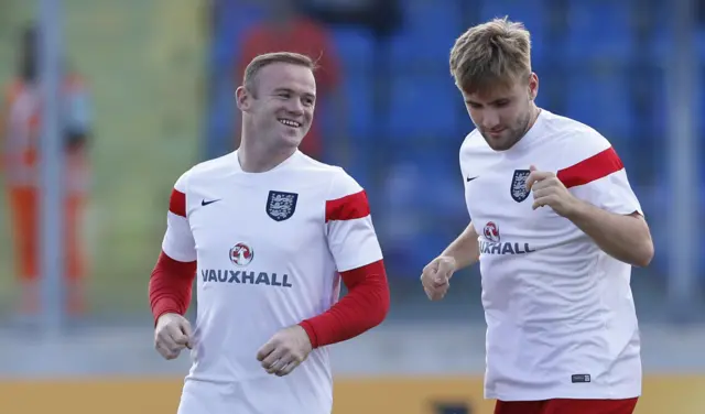 Wayne Rooney warms up