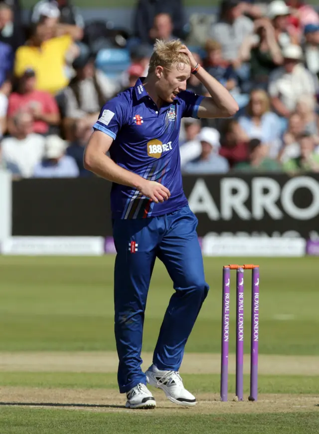 Liam Norwell reacts after dropped catch