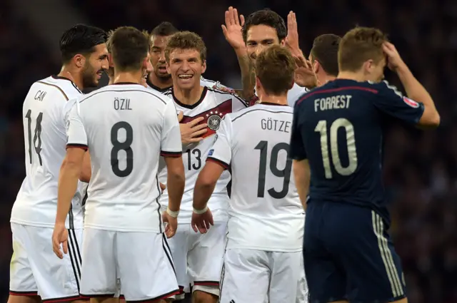 Forrest walks past the celebrating Germany players