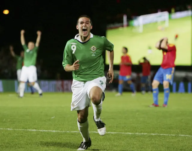 David Healy celebrates scoring against Spain