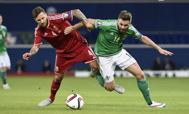 Stuart Dallas battles for the ball