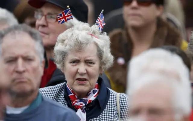 Woman with Union Jack flags in her hair