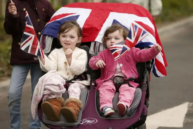 Children waving Union Jack flags