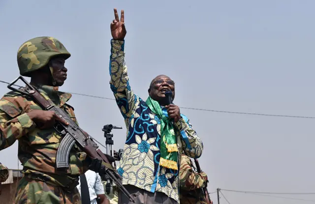 Central African Republic presidential candidate Martin Ziguele gestures during a campaign rally in the Muslim district of PK5 in Bangui on December 25, 2015 ahead of the country's presidential election