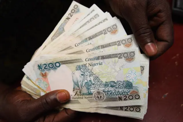 detail of some Nigerian Naira,(NGN) being counted in an exchange office on July 15, 2008 in Lagos, Nigeria