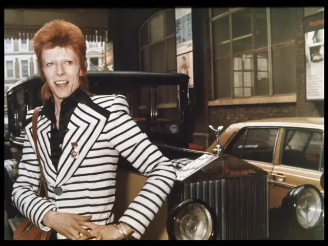 David Bowie with his vintage Rolls Royce in Ziggy Stardust phase