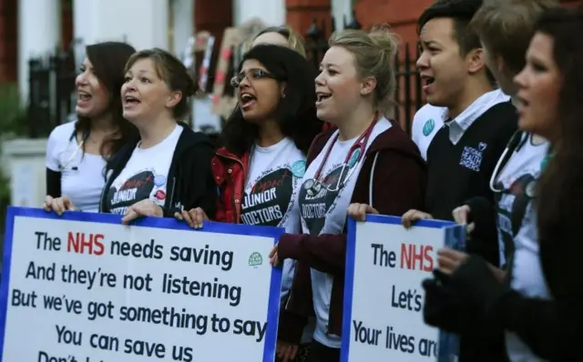 The British National Heath Service Singers, who are either doctors or nurses, perform a protest song in support of junior doctors outside Great Ormond Street Hospital for Sick Children,