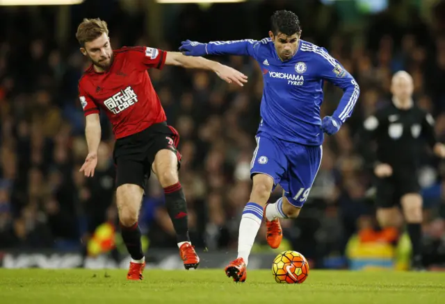 Diego Costa runs past James Morrison