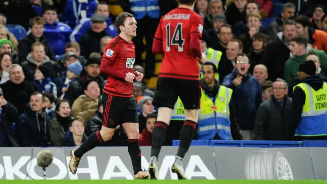 Craig Gardner celebrates