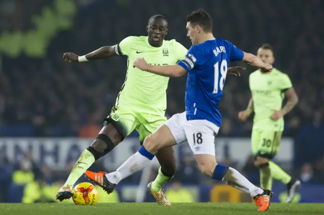 Gareth Barry (right) tackles Yaya Toure