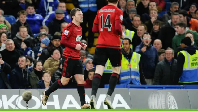 Craig Gardner celebrates