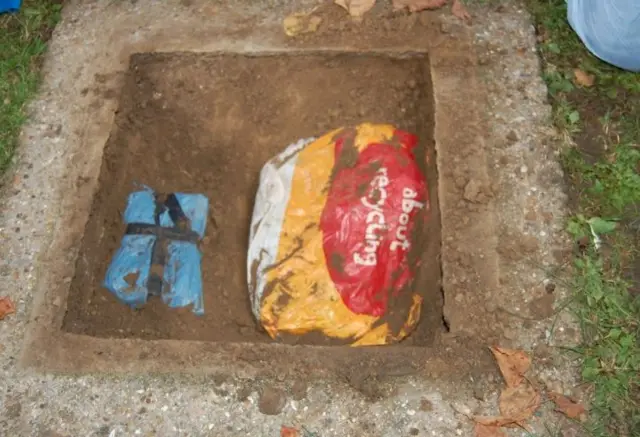 Handout photo issued by Metropolitan Police of items found within a grave at Edmonton cemetery