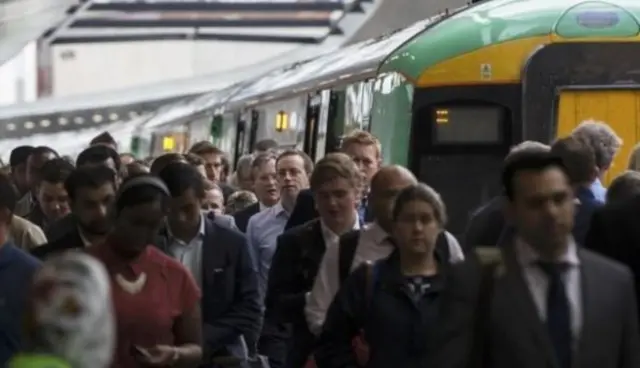 Commuters beside Southern train