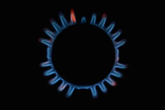 A photo illustration of rings on a gas hob