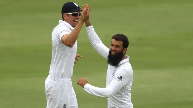 Moeen Ali celebrates with Alastair Cook