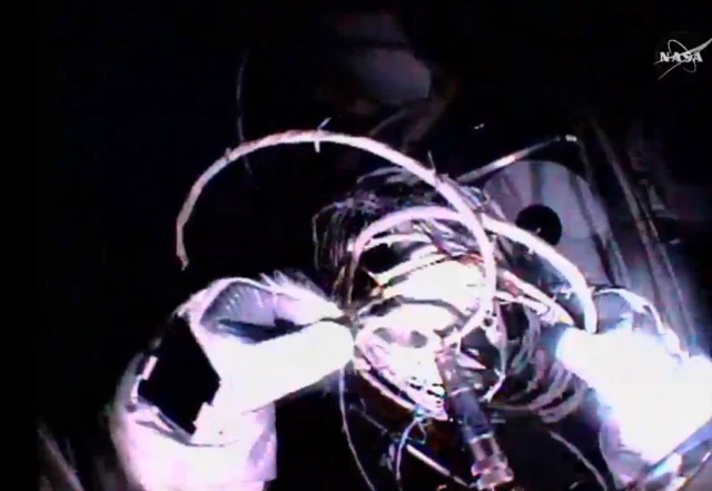 helmet camera view shows gloves handling cables