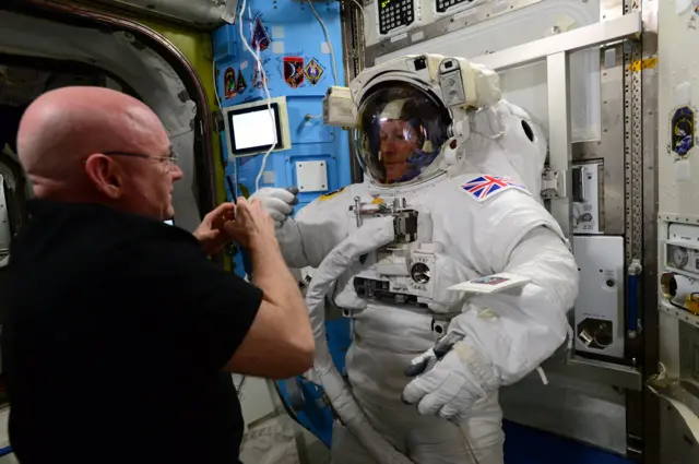 Tim Peake getting fitted in his suit