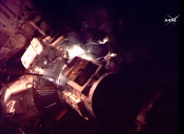 astronauts leaving the airlock