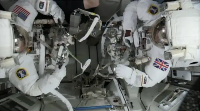 The astronauts getting ready for the spacewalk