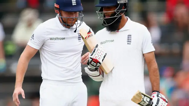 Moeen Ali looks at his broken bat