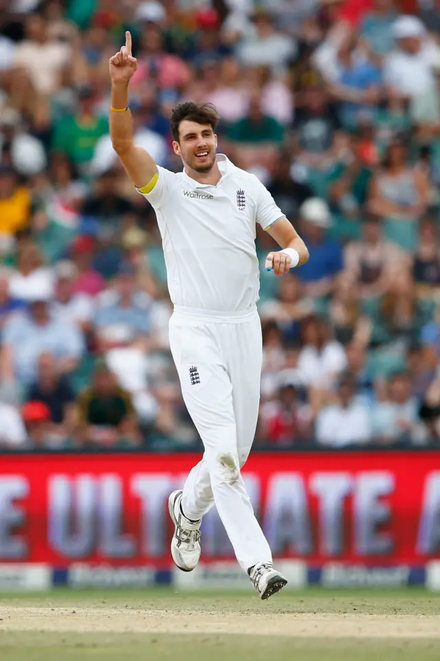 Steven Finn celebrates