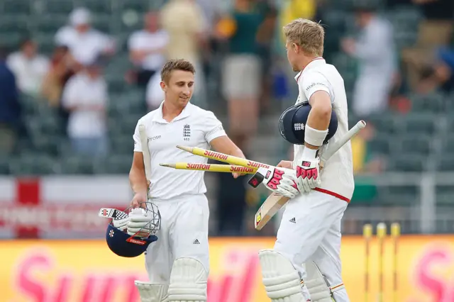 Joe Root and James Taylor at the end of the match