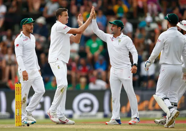 Morne Morkel of South Africa celebrates taking the wicket of Steven Finn