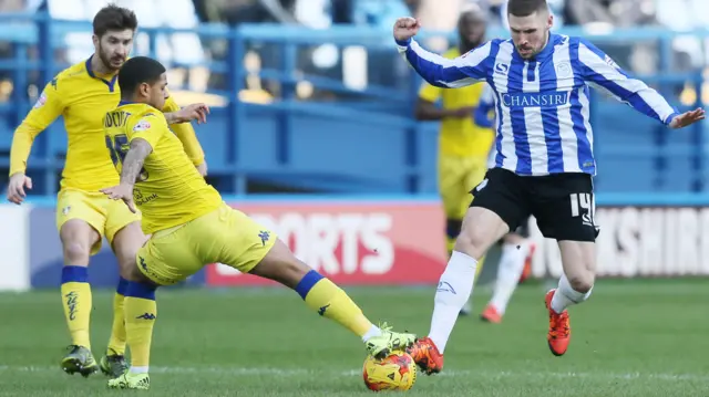 Liam Bridcutt tackles Gary Hooper