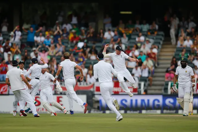 England celebrate wicket of Hashim Amla