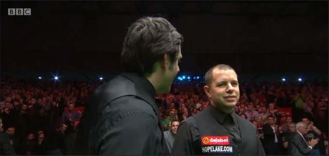 Ronnie and Barry Hawkins at the end of the match